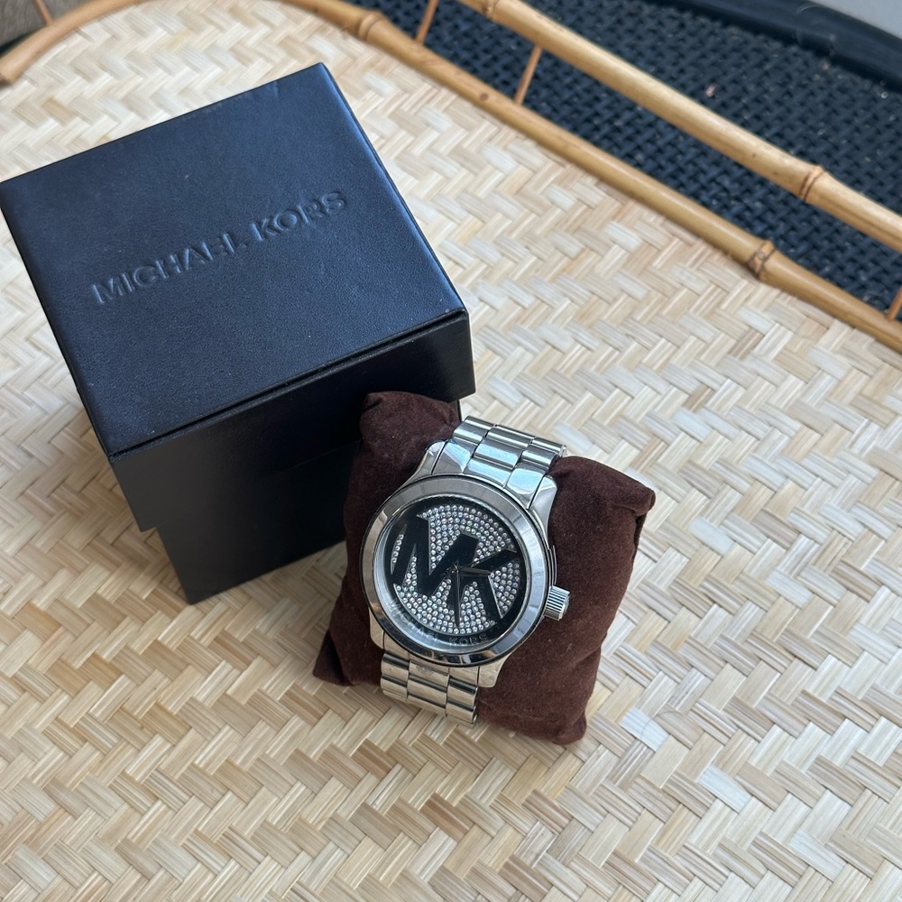 Female Michael Kors oversized silver toned watch